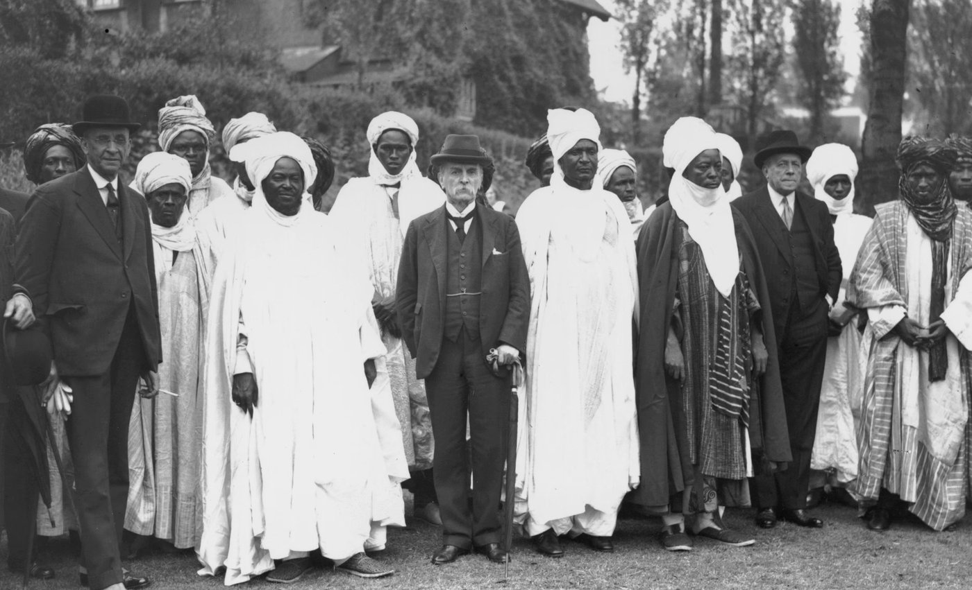 Frederick Lugard standing among the Sultan of Sokoto and northern emirs at the London Zoological Gardens